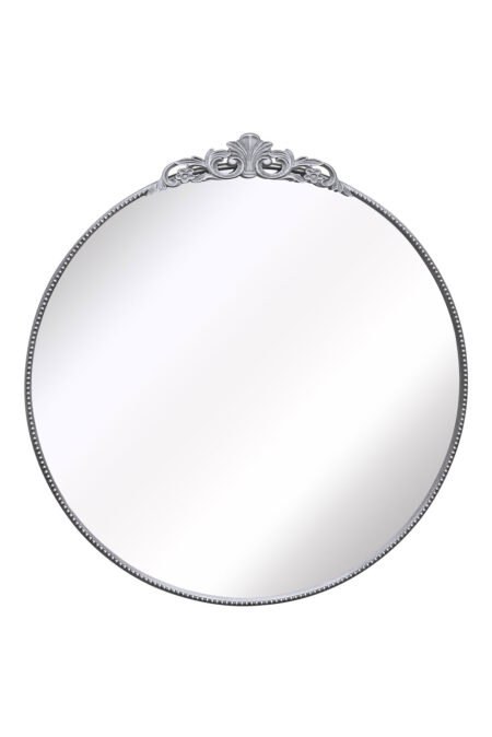 Front view of a round mirror with beaded frame and decorative floral crest