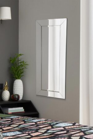 This modern wall mirror is available to purchase here at The Mirror Man