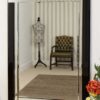 This black all glass wall mirror is available to purchase here at The Mirror Man