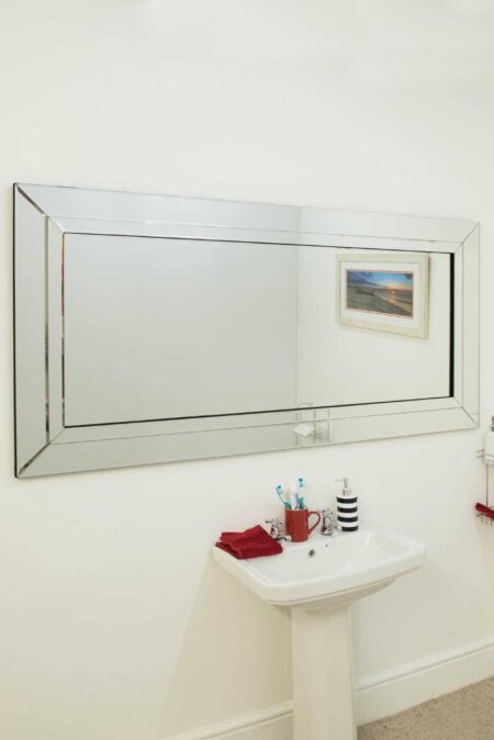 This full length frameless wall mirror is available to purchase here at The Mirror Man