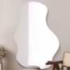 This abstract wall mirror is available to purchase here at The Mirror Man